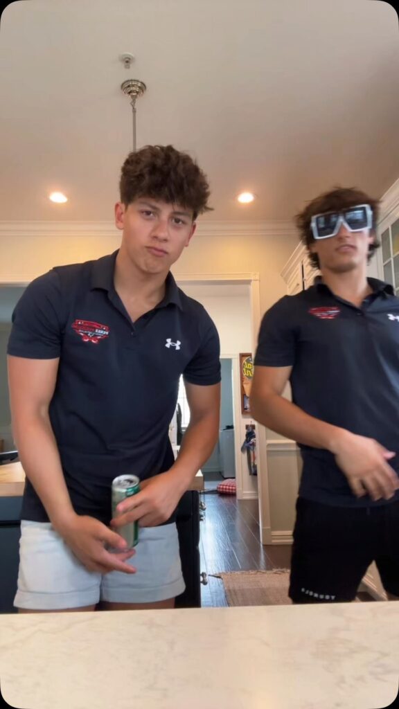 Kyle Abellar with friends at a formal event in suits